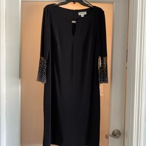 Black evening/event dress, never worn with tags, size 14.